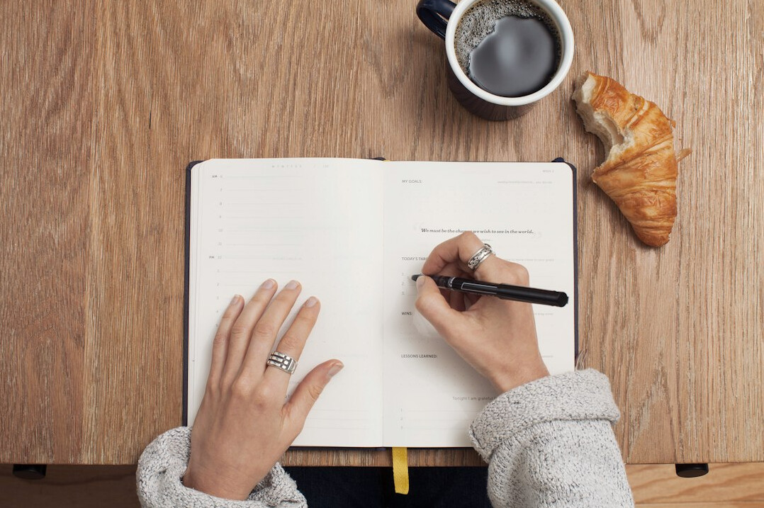 person writing notes